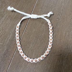 String bracelet with gold beads